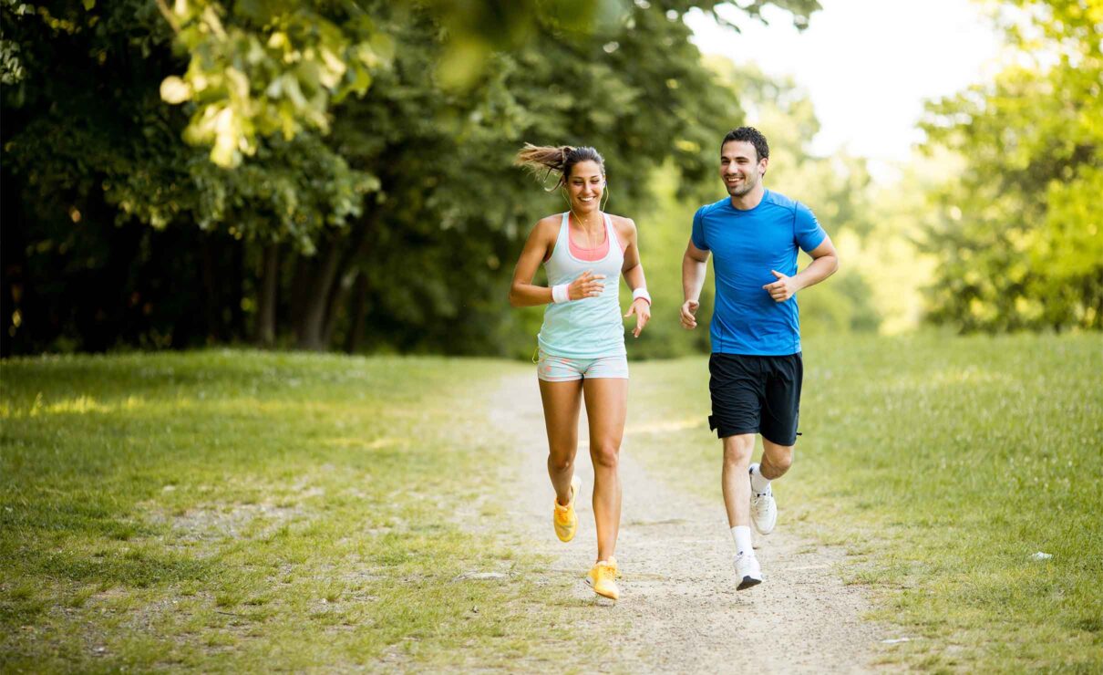 A photo of two people on a run